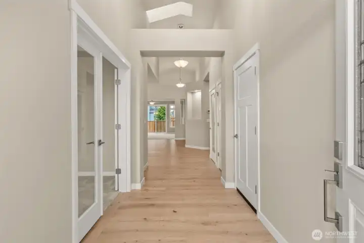 Welcome home! Step into the entry hall with hardwood flooring, contemporary details and white millwork throughout. Clear glass doors leading to den/office or 3rd bedroom.