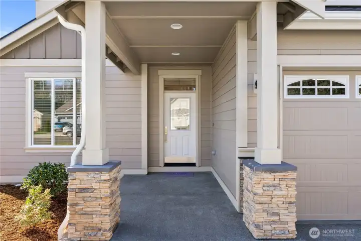 Covered front porch to welcome guests