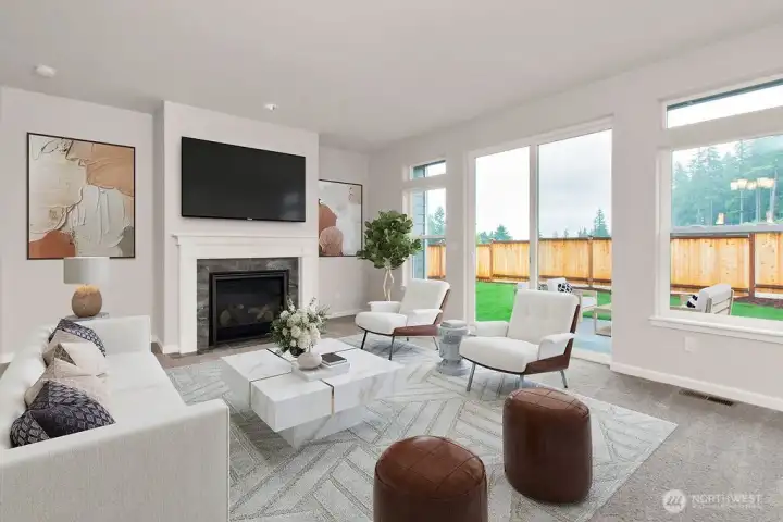 Light & Bright! Virtually staged photo showing the oversized windows and white trim and millwork.