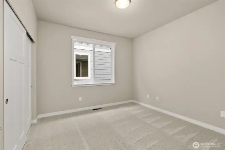 Adjacent to full bathroom is the second bedroom featuring a large reach in closet.