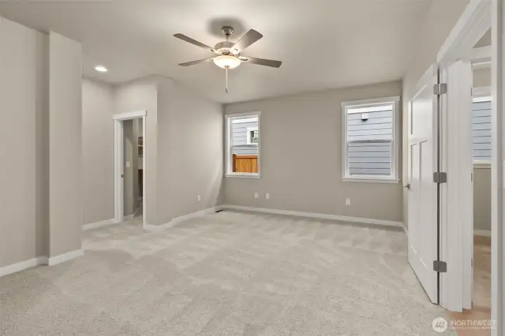 Primary bedroom featuring walk-in closet and 5-piece bath suite.
