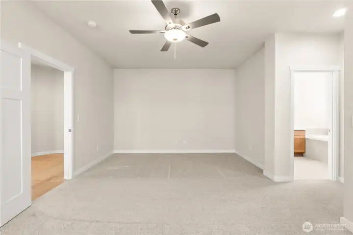 Primary bedroom with ceiling fan