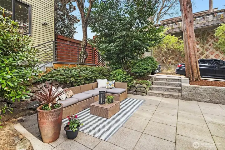 Shaded by mature greenery, this patio is lovely all year long