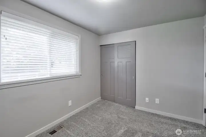 Another view of bedroom 3 with sliding door to a large closet
