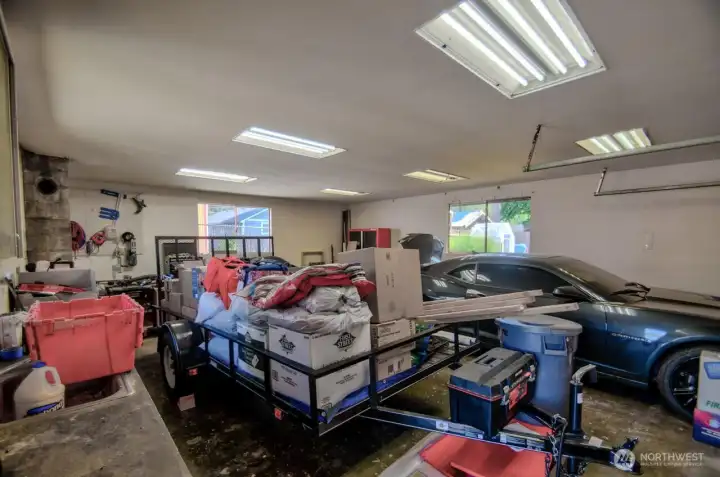 Need a shop for your hobbies - this home has the space! View of the shop with cabinets on the left