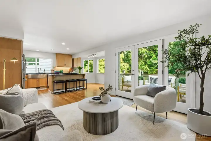 Family room, kitchen and deck off the back to green space and mountain views