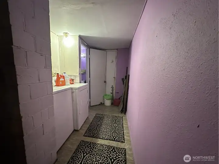 At the end of hall is exterior exit to back yard.  Bathroom to left at end of hall.