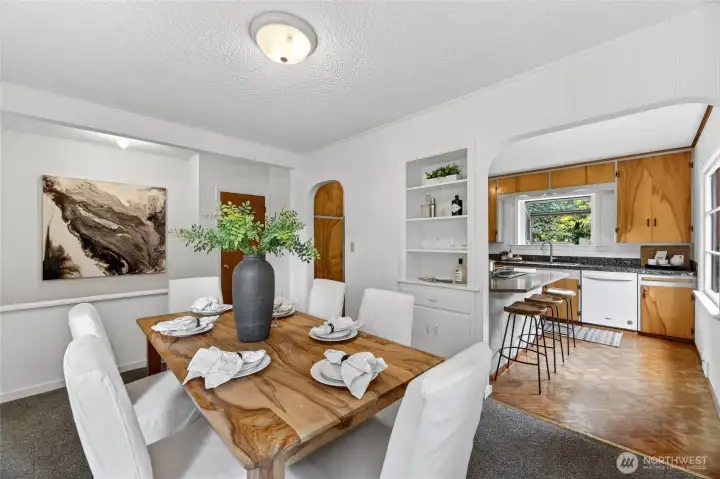 Full size dining room just off of kitchen with original built-ins.