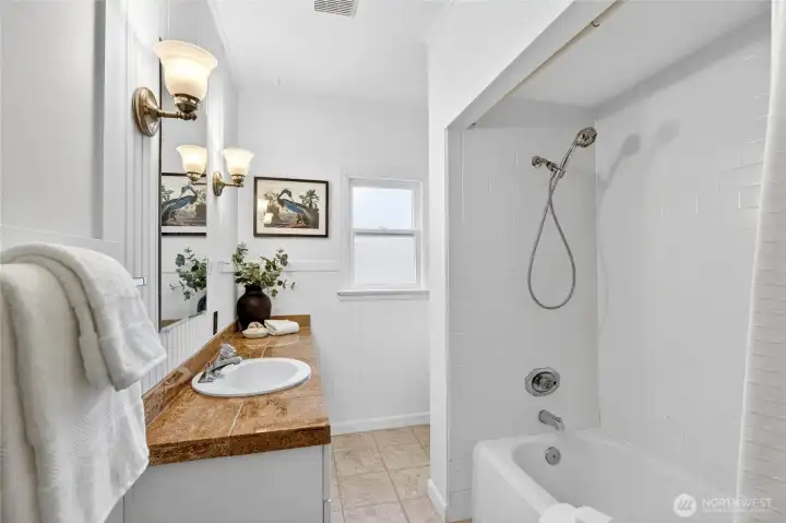 Large bathroom with plenty of counter space.