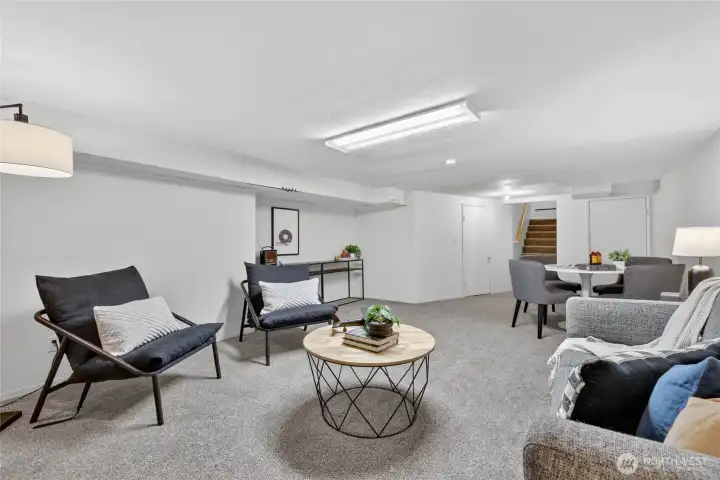 Another view of the downstairs space. Stairs are to the right.