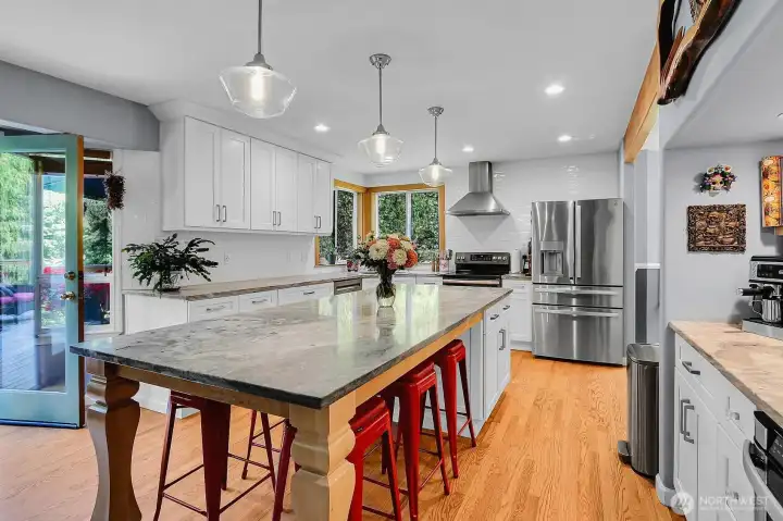 Entertaining Size Kitchen with Stainless Appliances, Quartz Countertops, White Cabinetry & Built-In Coffee Bar