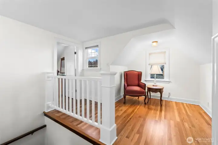 Reading Loft: A quintessential cozy corner, this loft area features sloped ceilings and a private window—the perfect spot for a reading chair or a quiet meditation space.