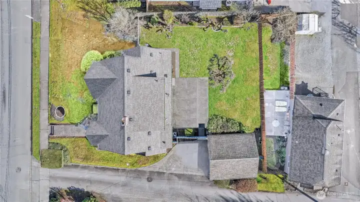 Aerial Overview: From above, you can appreciate the scale of this generous lot. The combination of the spacious backyard, the detached garage, and the prime corner-style positioning makes this 1930s Tudor a rare find.
