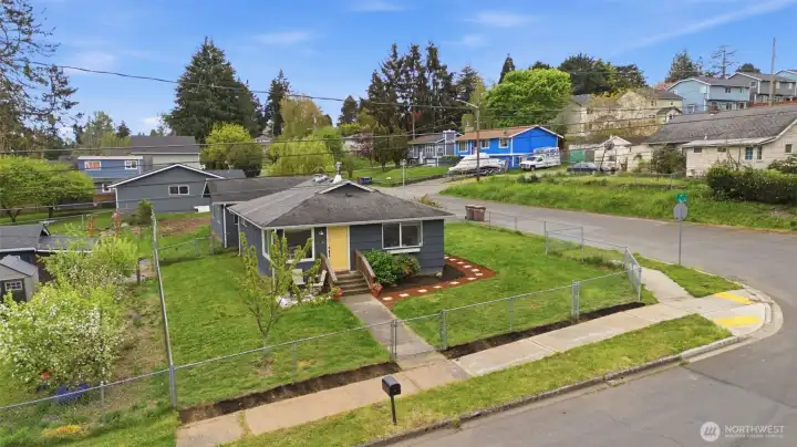 Tacoma corner lot home with spacious yard, detached garage, and strong curb appeal in convenient South Tacoma location.