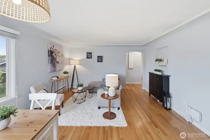 Bright Tacoma living room with hardwood floors, natural light, and open layout.
