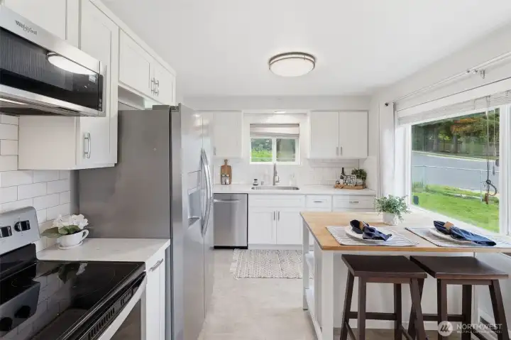 Modern kitchen with ample counter space, storage, and efficient layout.