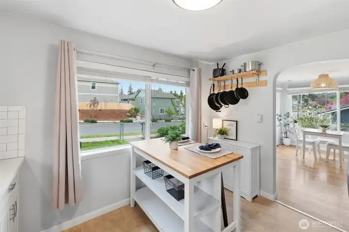 Dining area with backyard views and easy access to kitchen and living space.