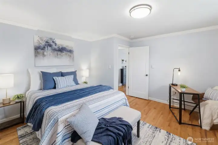 Spacious bedroom with neutral tones and versatile design.