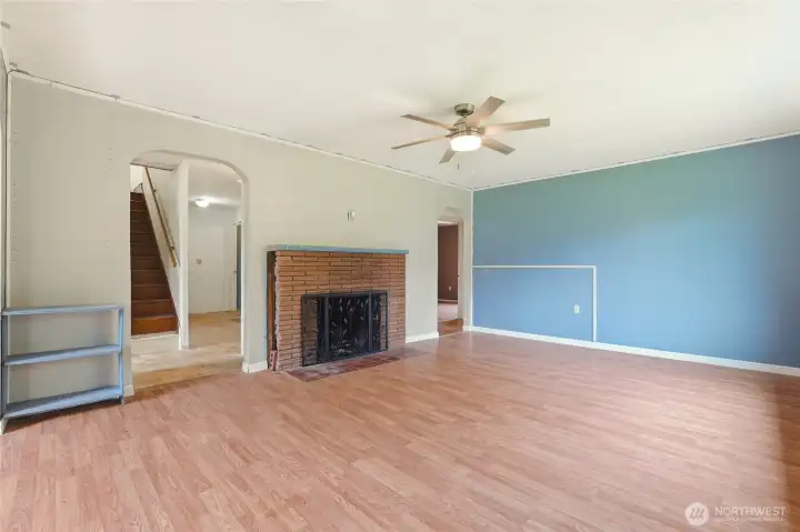 Open living space with a fireplace as the focal point