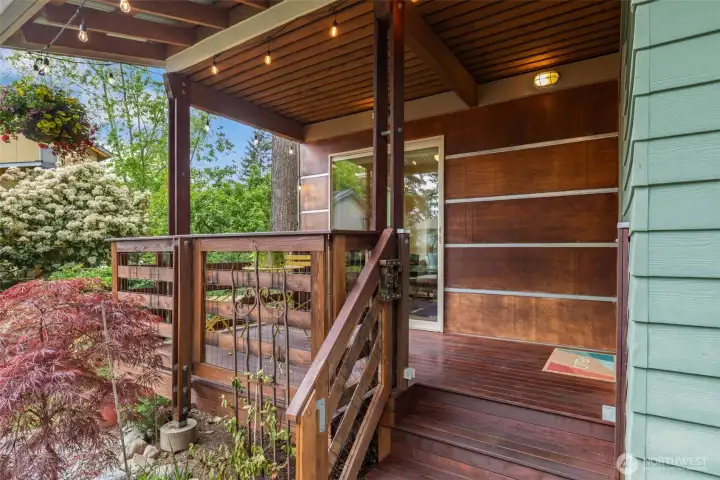 Private front porch has a dog gate so you both can enjoy summer evenings outside.