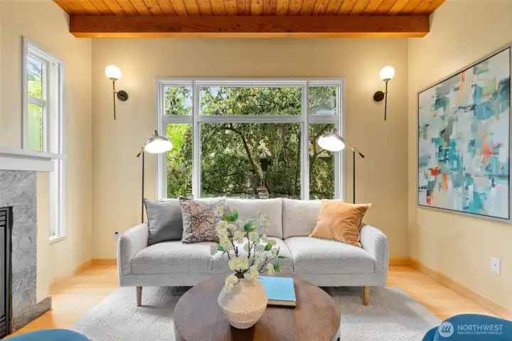 Large picture window in the living room overlooking the garden.