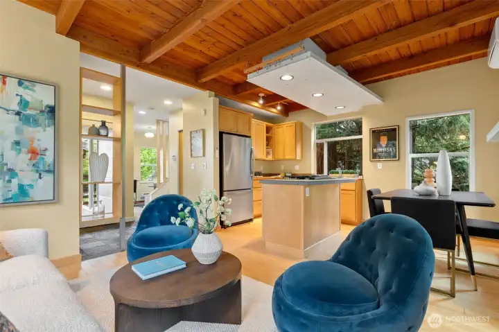 Open concept kitchen, dining and living rooms.