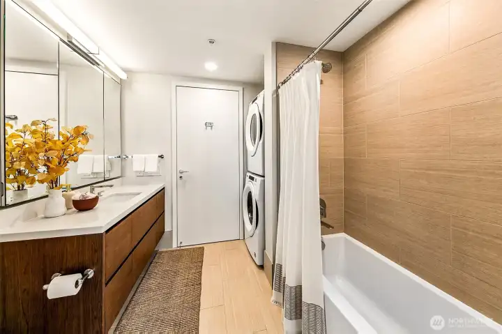 Spacious bathroom with full size washer & dryer.