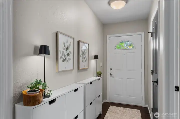 Welcoming entry, cabinets convey.