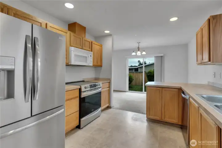 Most of the kitchen appliances have been updated with stainless steel. Newer french-door refrigerator stays!