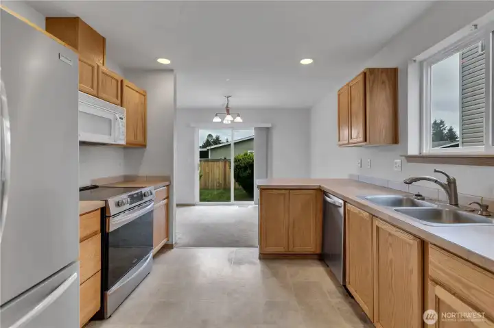 Kitchen looks out to the back yard ~