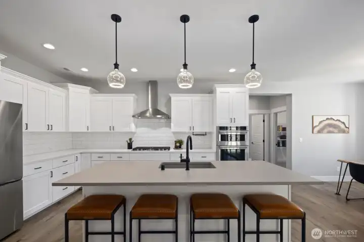The oversized kitchen island creates additional prep space, casual seating, and room to spread out, while included appliances and thoughtful upgrades make this newer home feel complete from the start. The oversized kitchen island creates additional prep space, casual seating, and room to spread out, while included appliances and thoughtful upgrades make this newer home feel complete from the start.