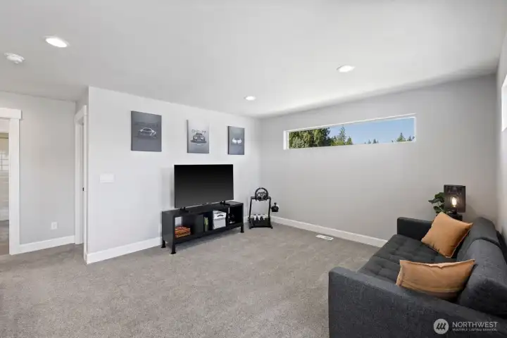 With multiple living spaces throughout the home, the upstairs loft creates added flexibility for movie nights, gaming, hobbies, work-from-home setups, or quiet evenings in. With multiple living spaces throughout the home, the upstairs loft creates added flexibility for movie nights, gaming, hobbies, work-from-home setups, or quiet evenings in.