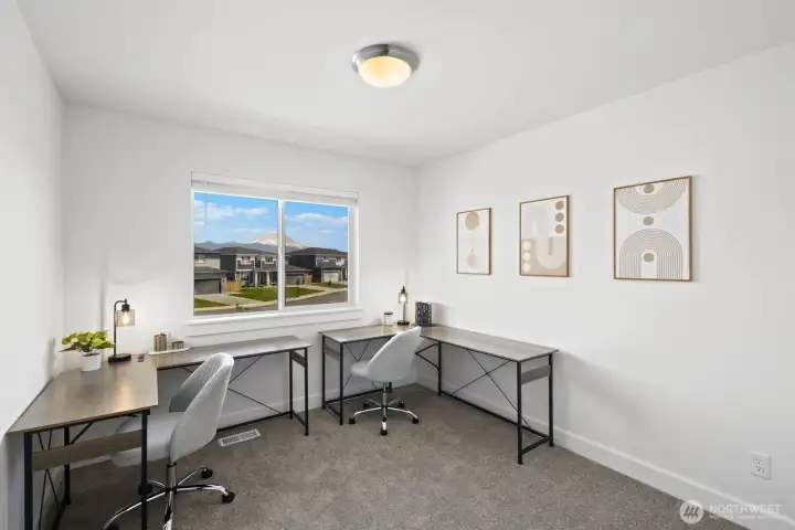 This flexible room can easily function as a home office, study space, hobby room, or additional guest area depending on your needs, with Mount Rainier views adding to the setting upstairs. This flexible room can easily function as a home office, study space, hobby room, or additional guest area depending on your needs, with Mount Rainier views adding to the setting upstairs.
