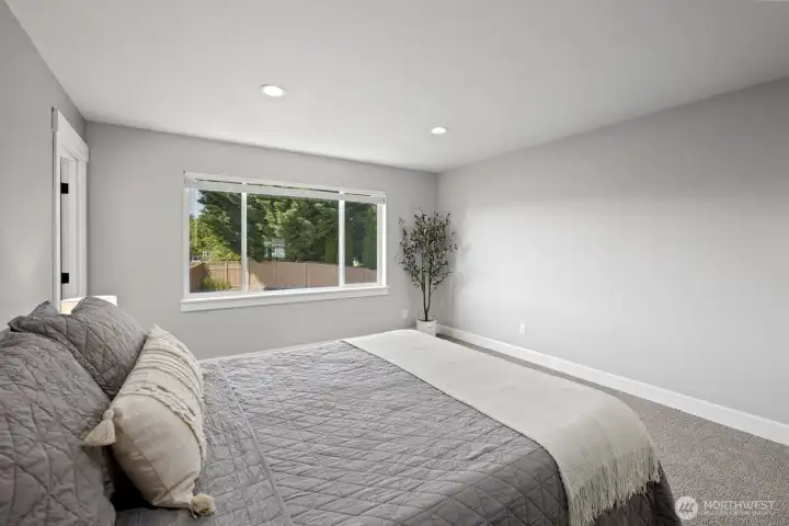 Designed with comfort in mind, the primary bedroom offers generous space for a full furniture setup while still feeling open, bright, and relaxing. Designed with comfort in mind, the primary bedroom offers generous space for a full furniture setup while still feeling open, bright, and relaxing.
