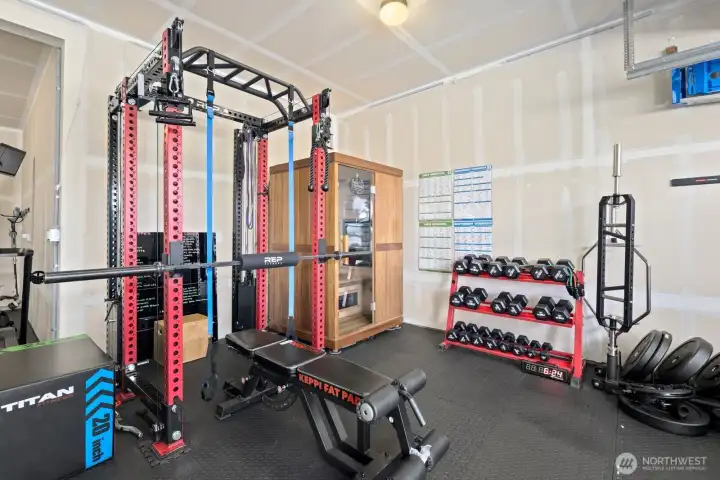 Currently outfitted as a functional home gym, the garage offers flexible space that can easily adapt to fitness, storage, workshop needs, or additional recreational use. Currently outfitted as a functional home gym, the garage offers flexible space that can easily adapt to fitness, storage, workshop needs, or additional recreational use.