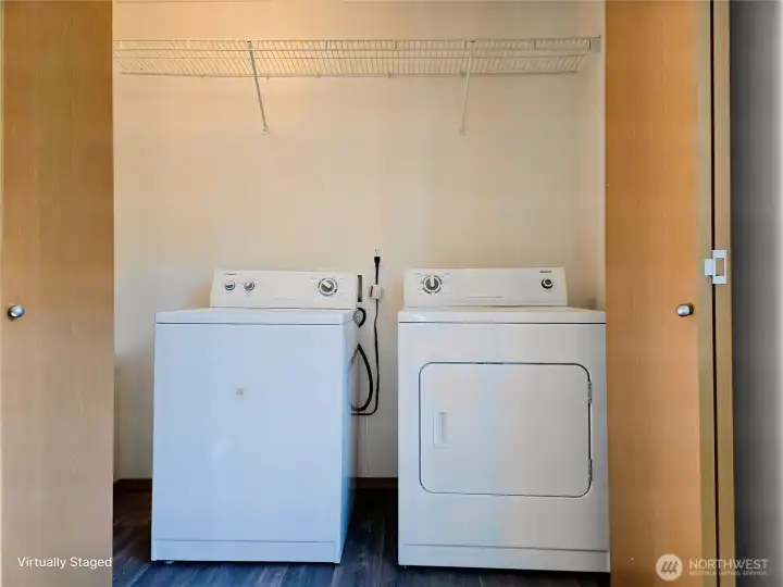 Washer/Dryer behind folding doors.