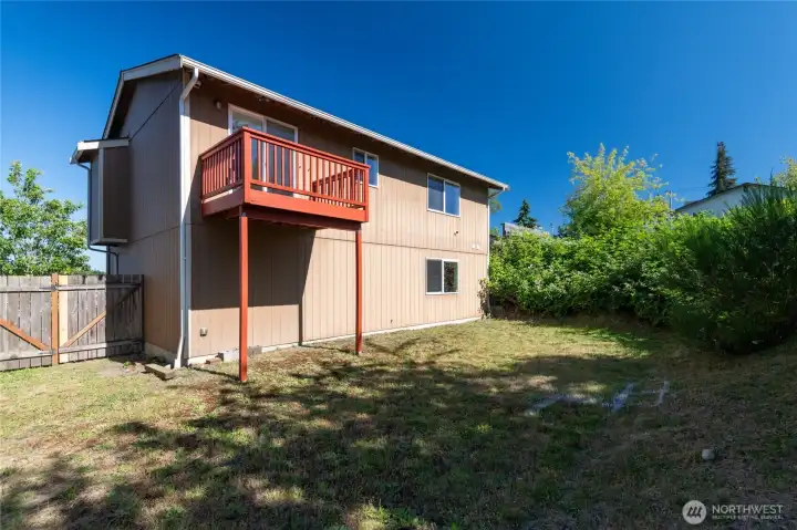 back yard with upper deck.