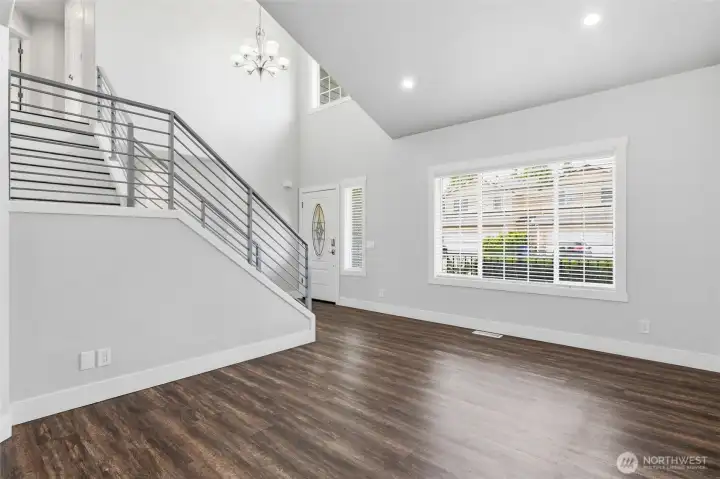Formal living room with modern stair case