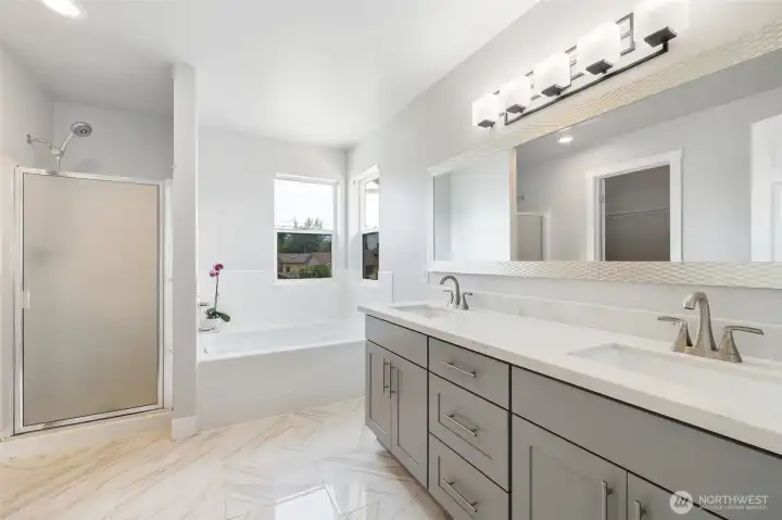 Primary bathroom with his and hers sinks.