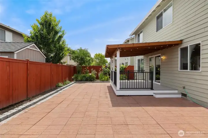Backyard with pavers, perfect for entertaining.