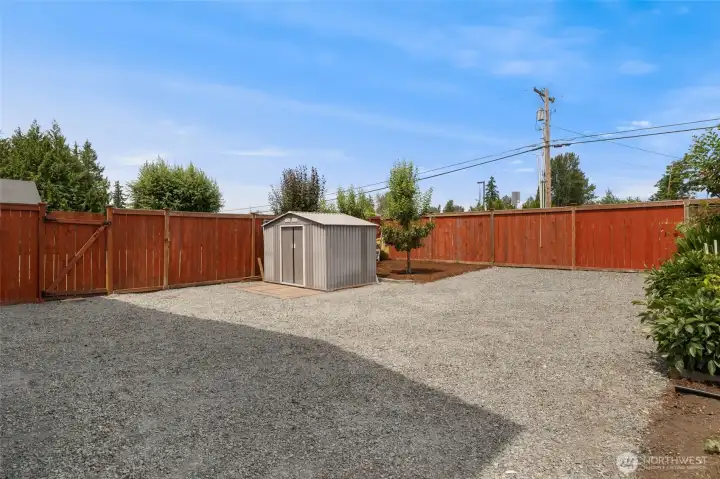 Gravel section of backyard perfeect for parking R.V. or boat.