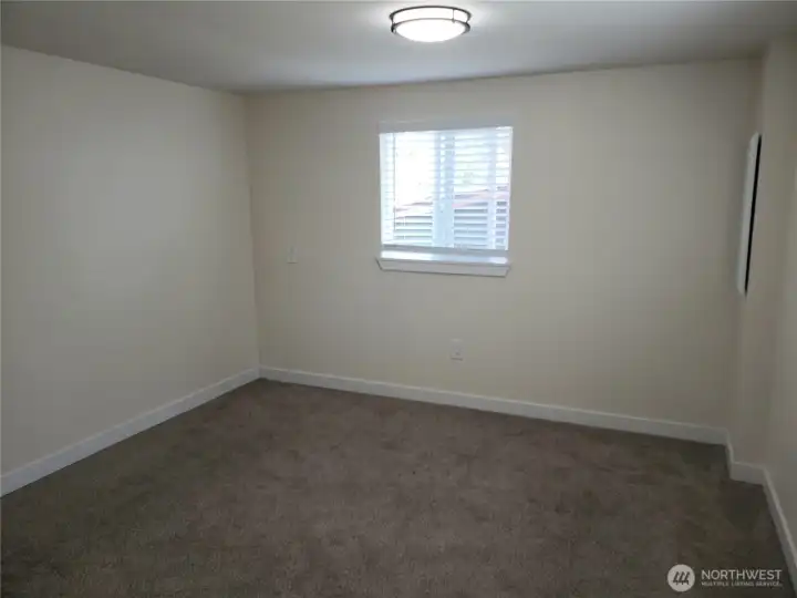 Spacious Primary Bedroom with New Paint, Trim, Blinds and Carpeting. Spacious Primary Bedroom with New Paint, Trim, Blinds and Carpeting.