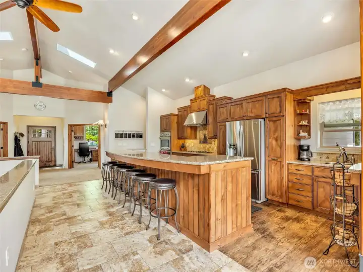 Warm wood cabinetry, quality finishes, and an open floor plan anchor the heart of the home. Warm wood cabinetry, quality finishes, and an open floor plan anchor the heart of the home.