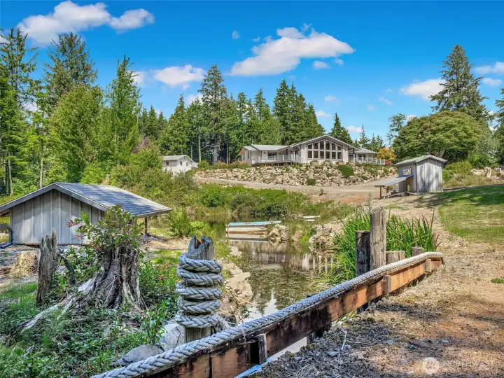 Second overflow pond with chicken/duck house all with a private path that circles the property. Second overflow pond with chicken/duck house all with a private path that circles the property.