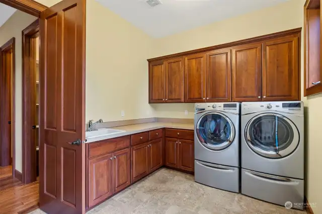 Generous Laundry Room and lots of storage cabinetry.