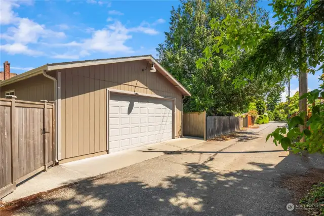 This oversized 2 car garage sits off a paved alley and ready for the car enthusiast, hobbyist. Room for 2 cars (plus another on in the attached front garage) as well as a workshop/storage area.