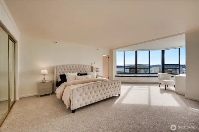 King size primary suite redesigned with new window seat & custom built-in desk, shelving & cabinetry for maximum storage.