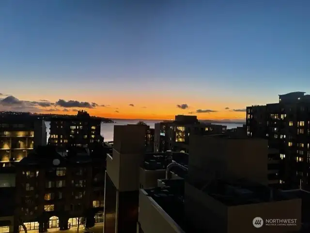 Sunsets are spectacular from both the home & rooftop deck! This is a seller photo.