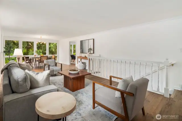 This inviting family room seamlessly connects to the dining area, creating an effortless flow for gatherings and everyday living. Whether hosting a meal or unwinding afterward, the layout makes transitions smooth and natural.