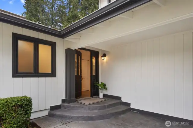 A welcoming entrance with effortless access. The gently curved steps lead to a sheltered front door, framed by elegant glass panels for a bright and stylish first impression.